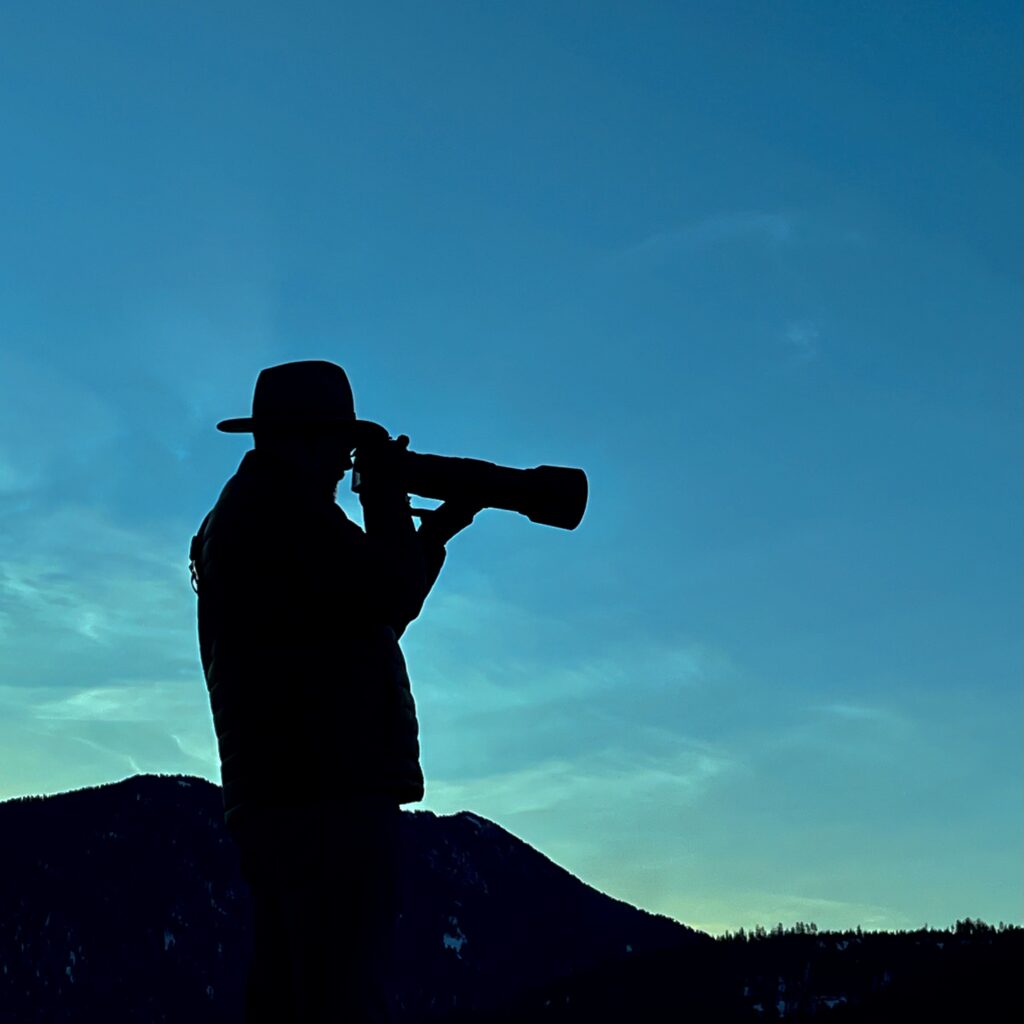 A silhouette of me taking a photo with a long lens